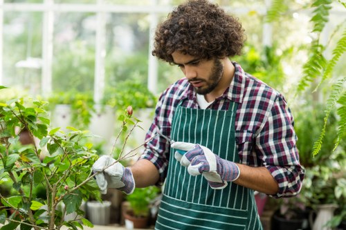 Professional gardeners working in a lush Enfield garden