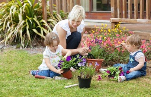 Gardener in front garden in Enfield preparing for work