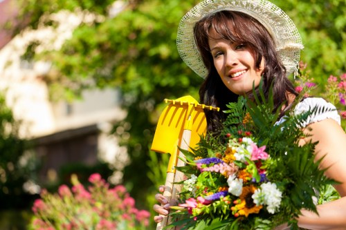 Satisfied customer reviewing cleared garden area